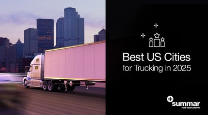 truck driving towards a city